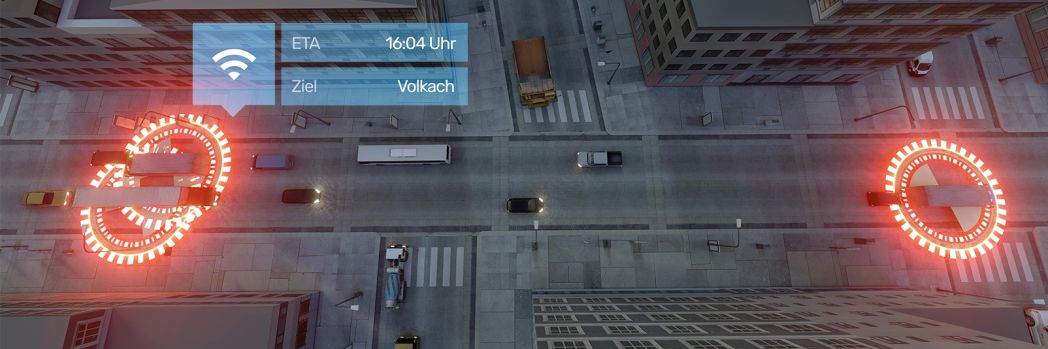 Perfectly timed processes: Time slot management in logistics. A bird's eye view of a road junction with various vehicles. It shows GPS symbols and a message about the ETA.