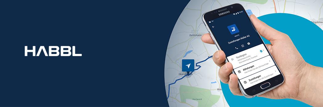 On the left, the white lettering HABBL on a dark blue background. On the right, a hand with a mobile phone and a road map underneath.
